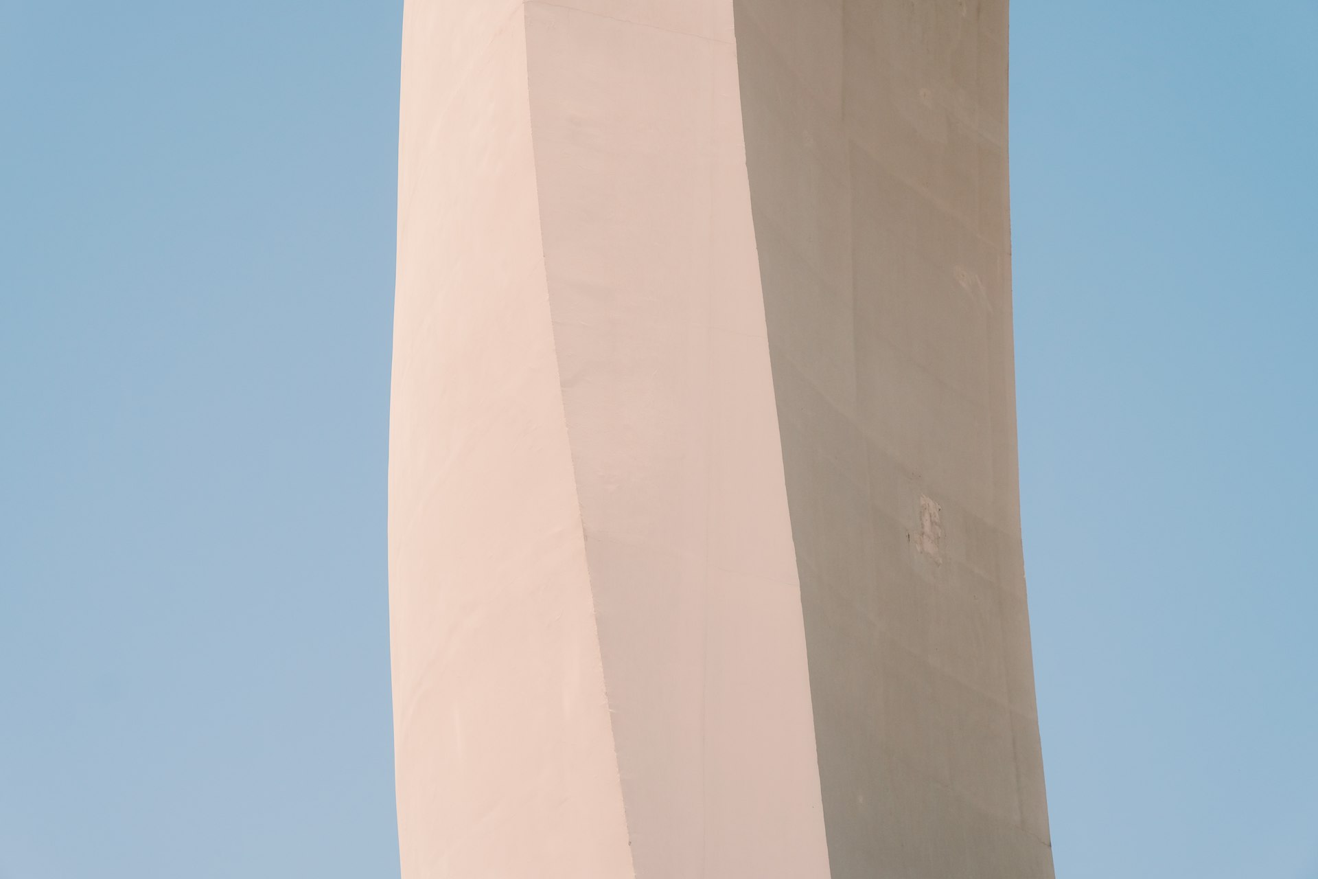 beige concrete building under blue sky during daytime